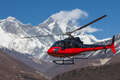 Helicopter Flying Over Snow-capped Himalayan Mountain