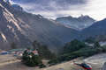 Helicopter Landing In Remote Himalayan Village Surrounded By Mountains In Nepal