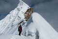Mountaineer Standing On Snowy Ridge Near The Lobuche Peak
